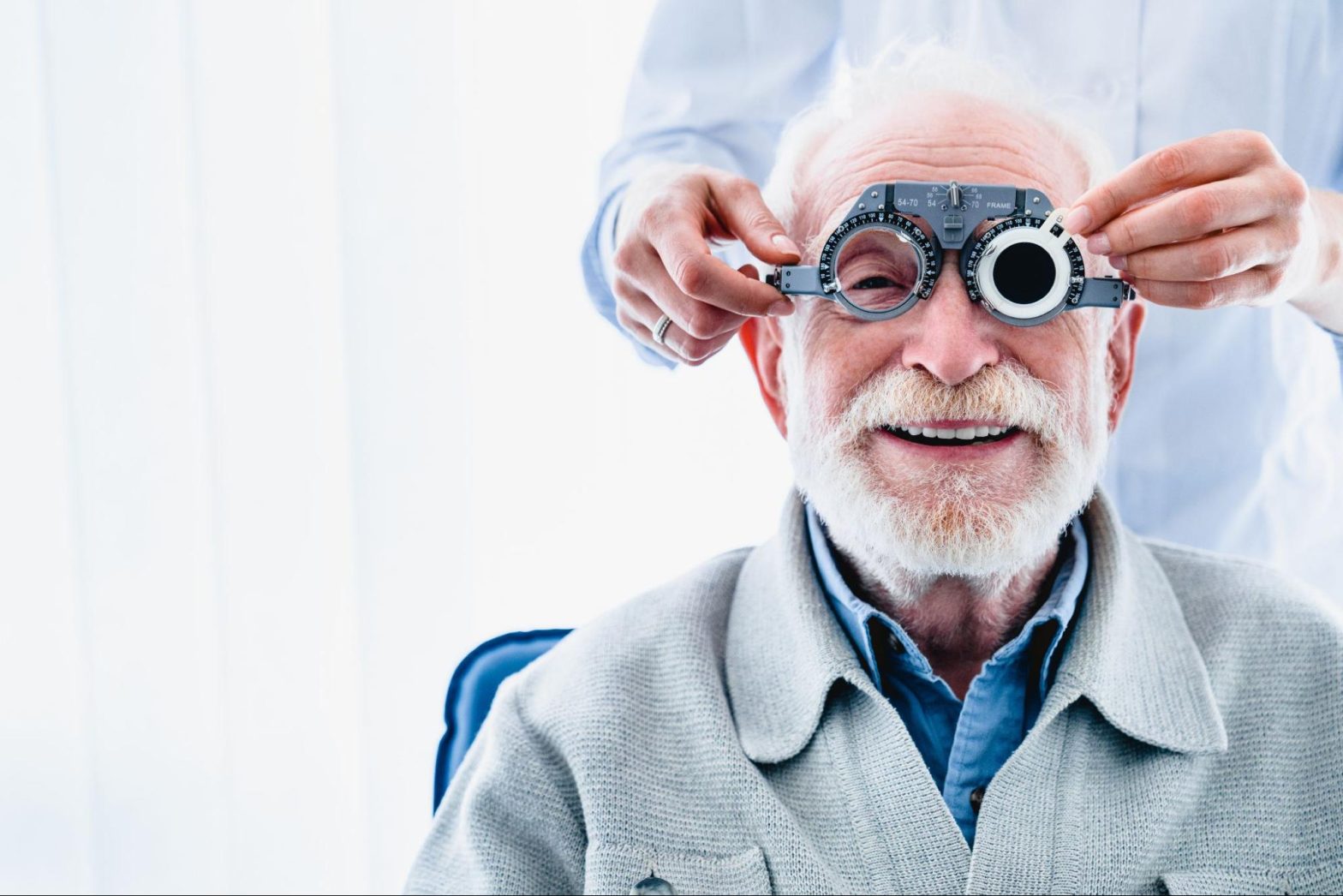 Elderly man receiving an eye exam